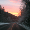 sunrise over snowy road