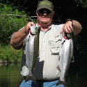 angler with two chinook salmon