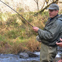 fish on, bent rod with hooked coho salmon